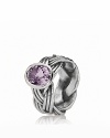 A braided band in sterling silver grounds a faceted, bezel-set pink amethyst stone. Ring by PANDORA.