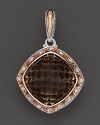 Diamonds, set in sterling silver and 18K. pink gold, frame a cushion cut smoky quartz. By Tacori.