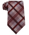 Pave your way to polished style with this grid-patterned silk tie from Calvin Klein.