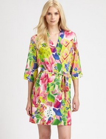 Eye-popping florals in vibrant hues cover this silky-smooth wrap. V-neckThree-quarter length sleevesSelf-tie waistAbout 35 from shoulder to hem92% polyester/8% spandexMachine washImported