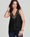 The boldly printed lining of this GUESS top is cleverly obscured by a sheer overlay. The design is punctuated by a pattern of beads at the neckline for a glam finish.