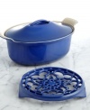 Update your setting with this instant classic. Perfect for oven to table presentation, this oval coquette and trivet duo is crafted from enameled cast iron in a striking hue that lights up your tabletop. From stir-fry to a slow-cooked casserole to a cake, this oval coquette distributes heat evenly and the secure lid traps in moisture and heat for remarkable results that leave guests coming back for more. Lifetime warranty.