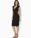 A flattering wrap-silhouette dress is trimmed with soft faux suede, becoming a heritage-inspired classic.