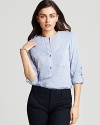 Spring's chambray trend arrives with this Vince shirt boasting a partial front placket and rounded hem. At back is a single pleat for a final touch of preppy chic.