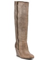 Long and lean, these leather boots get flattering height from a towering wedge heel. From STEVEN BY STEVE MADDEN.