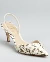 A dramatic pointed toe is paired with snake printed leather for the ultimate in statement making footwear. From Delman.