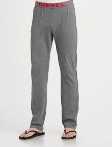 Soft cotton lounge pants with a logo waistband and athletic stripe along sides.Elasticized logo waistbandBack pocketInseam, about 32CottonMachine washImported