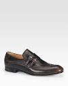 Leather moccasin with double-buckle instep strap detail. Leather sole Made in Italy 