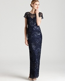 Aidan Mattox dresses up a simple sheath silhouette with a long length and sparkling, sequined floral details.