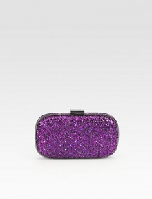 Be the star of the party with this unique light-up design in sparkling two-tone glitter.Top clasp closureOne inside open pocket with battery packVelvet lining8W X 4¾H X ½DImported