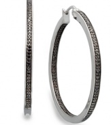 Bolder and better. Black diamonds are the latest craze in fine jewelry and these round-cut black diamond hoop earrings (1/2 ct. t.w.) will add the perfect touch to your collection. Set in sterling silver. Approximate diameter: 1-1/2 inches.