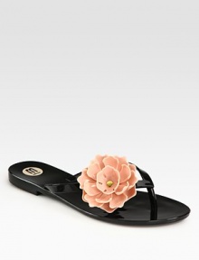 An oversized, dimensional flower blossoms on this durable PVC essential. PVC upperRubber soleImported