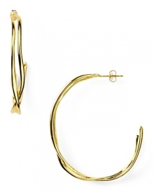 Alexis Bittar's golden hoops are a striking example of the label's contemporary edge. With a fluid shape, these orbiting earrings add a hit of celestial glamour to your look.