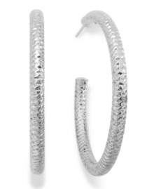 Sleek and sophisticated. Alfani's traditional hoop earrings feature a reflective diamond cut, lending a textured finish. Crafted in silver tone mixed metal. Approximate diameter: 2 inches.