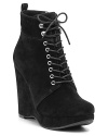 Lace up these suede wedge booties for a soft take on the rugged desert bootie trend. By MICHAEL Michael Kors.