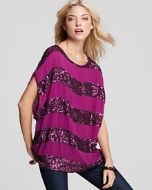 Sequin stripes glam up this Alice + Olivia tunic, rendered in violet silk chiffon for a super-saturated punch. Wear it with skinnies and towering pumps for a high-shine cocktail hour.