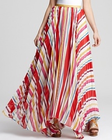 Teeming with crinkled pleats, this fête-fabulous Alice + Olivia skirt flaunts variegated stripes in a rainbow of hues to enliven the party! Make the maxi the focal piece of your look and pair it with a sleek white blouse.