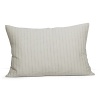 Alternating rows of slub yarns in cotton and linen give a natural, textural feel to this decorative pillow.