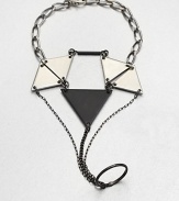 From the Facet Collection. This distinctive design of powder-coated brass and pewter triangles clasps around the wrist, slips around one finger and drapes across the hand for eye-catching drama.Powder-coated brass and pewterLength around wrist, about 8 (adjustable)Lobster claspMade in USA