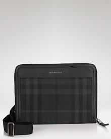 A dark smoky check pattern makes a sleek statement on this iconic crossbody messenger from Burberry.