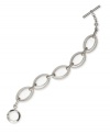 Simple luxury in chic, oval links. Monet design features a trendy toggle bracelet in silver tone mixed metal. Approximate length: 7-1/2 inches.