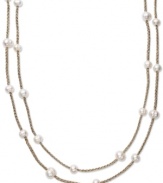 True treasures of the deep. Cultured freshwater pearls (8-10 mm) make a strong statement upon intricately woven gold tone polyester thread. Necklace is long enough to wrap twice for added volume. Approximate length: 64 inches.