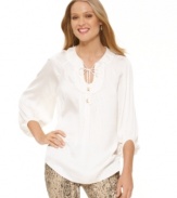 Be relaxed while looking your best. This embellished peasant blouse from Vince Camuto boasts a voluminous shape that flatters in white for Spring.