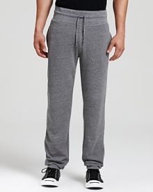 Heathered ALTERNATIVE sweatpants in plush fleece with an elastic waistband and ankle cuffs.