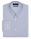 Dress shirt with spread collar, two button barrel cuffs and a slimmer fit through the body, with a blue grid pattern.