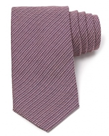 Carefully woven for a handsome check design, this premier tie from Armani Collezioni is made from lavish Italian silk for a luxurious addition to your wardrobe.