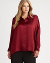 A sophisticated button-front blouse made from sumptuous silk. Tuck this style into a pencil skirt or pair it with your favorite straight-leg pants.Collar neckLong sleevesButton cuffsButton-frontAbout 27 from shoulder to hemSilkDry cleanImported