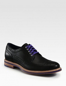 Sharp detailing, contrasting colors and allover perforations makes this sleek oxford design one step ahead of the rest.Leather upperLeather liningPadded insoleRubber soleImported