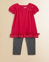 Sweet bows, sequins and ruffles adorn this adorable sweater tunic and leggings set.  Tunic Ribbed roundneckShort puff sleevesBow and sequin accentsRuffled hemBack keyhole with button closure Leggings Elastic waistbandPull-on styleTunic: cotton/acrylicLeggings: cotton/spandexMachine washImported