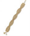 A hint of luxury. Alfani's luminous bracelet combines woven chains and crystals for an evening-perfect effect. Set in gold tone mixed metal. Approximate length: 8 inches.