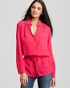 A cinched waist adds sophistication to this comfy-chic C&C California tunic.