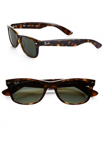 Funky two-tone frames update this modern wayfarer style. Available in black with green lens or havana with brown lens. Plastic Made in Italy 