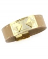 Wrap it up. Complete your whole look with this versatile band bracelet by Vince Camuto. Crafted from brown sugar-colored leather, bracelet features a trendy magnetic clasp with pyramid stud detail. Crafted in gold-plated mixed metal. Approximate length: 7 inches. Approximate width: 3/4 inch.