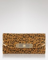 Sam Edelman's cheetah clutch is a fierce alternative to your basic black abg. Tuck the savage beauty under your arm with a colorful dress and head out for a wild night.