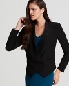 A sharp asymmetric hemline is eye-catching on this Rebecca Minkoff silk blazer, replete with puff shoulders and pleating at the elbows. A finishing touch for your cocktail silhouettes, this forward style lends modern edge to the most classic looks.