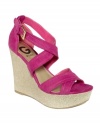 Light up your day with criss crossing straps. G by Guess' Lasino platform wedge sandals are strappy and stylish, yet completely walkable. The perfect cute shoe for a summer stroll.