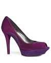 Subtle colorblocking in regal shades of purple adds dimension to these Stuart Weitzman peep toe platforms that rock the '70s renaissance.