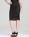 Leather piping edges up this DIANE von FURSTENBERG lace pencil skirt for tough-chic style.