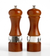 Add depth to any dish and décor with classic salt and pepper mills interpreted for the contemporary kitchen. The tall, beautifully contoured bodies are finished in elegant walnut, offset with a see-through stripe of acrylic that lets you view the mill's contents. Limited lifetime warranty.