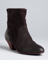 Flip them up or fold 'em down; versatile cuffs add interest to these Western-influenced Rebecca Minkoff booties.