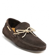 From Salvatore Ferragamo, a classic loafer rendered in fine Italian suede with contrast topstitch accents and lace detail.