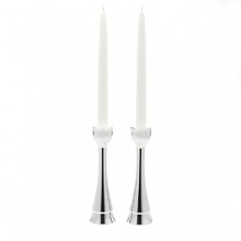 Recite your Sabbath blessings in the presence of candles lit in this pair of noble, clean-lined candleholders. The sticks rise triumphantly to cup and hold the candles and the dancing light reflects off the metal. Individual artists use Nambe, a superior metal alloy that retains heat and cold. Candleholders stand 8 high.