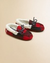 A classic slip-on slipper lined in plush faux shearling with a preppy woven plaid design.Slip-onWool upperFaux shearling liningRubber solePadded insoleImported