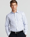 This elegant Michael Kors tailored shirt boasts a slim fit and sky blue alternating stripe pattern.