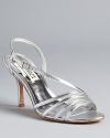 In gleaming metallic leather, the Guinevere sandal offers captivating evening style. From Badgley Mischka.