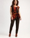 Featuring a bold, abstract look, a silk top with a flattering side tie and gathered details.Round neckCap sleevesAllover printSide tie at draped waistAbout 27 from shoulder to hemSilkDry cleanImported